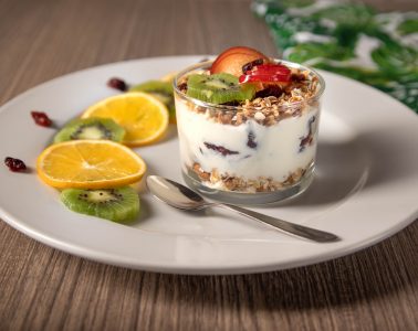 ice cream with sliced lemon on white ceramic plate