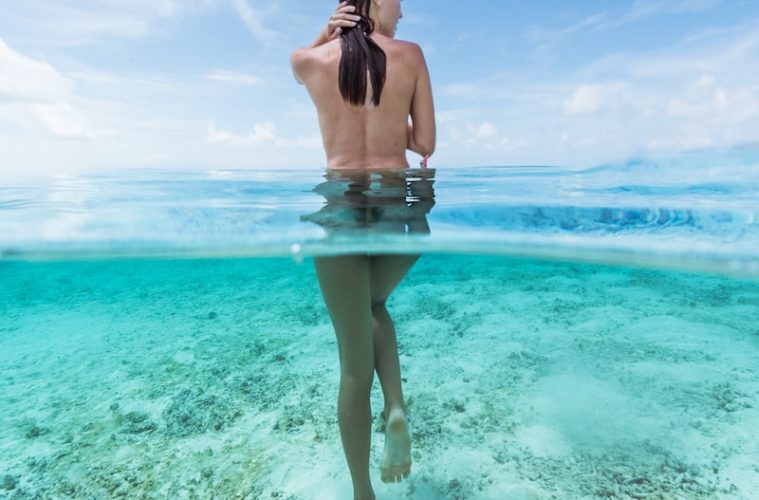 naked woman in water at daytime