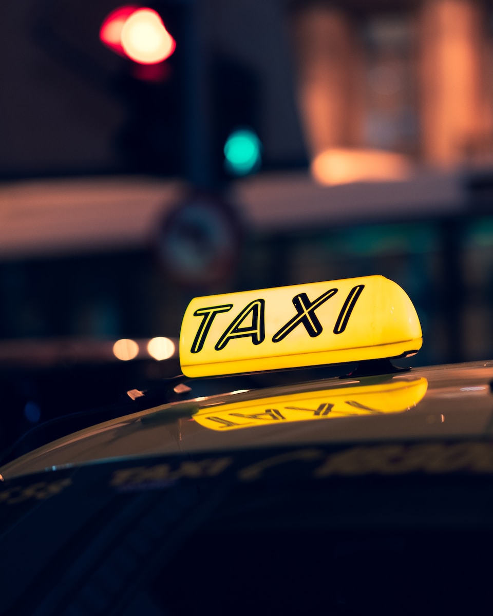 yellow taxi cab on road during night time