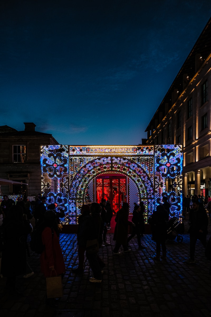 a group of people standing in front of a building
