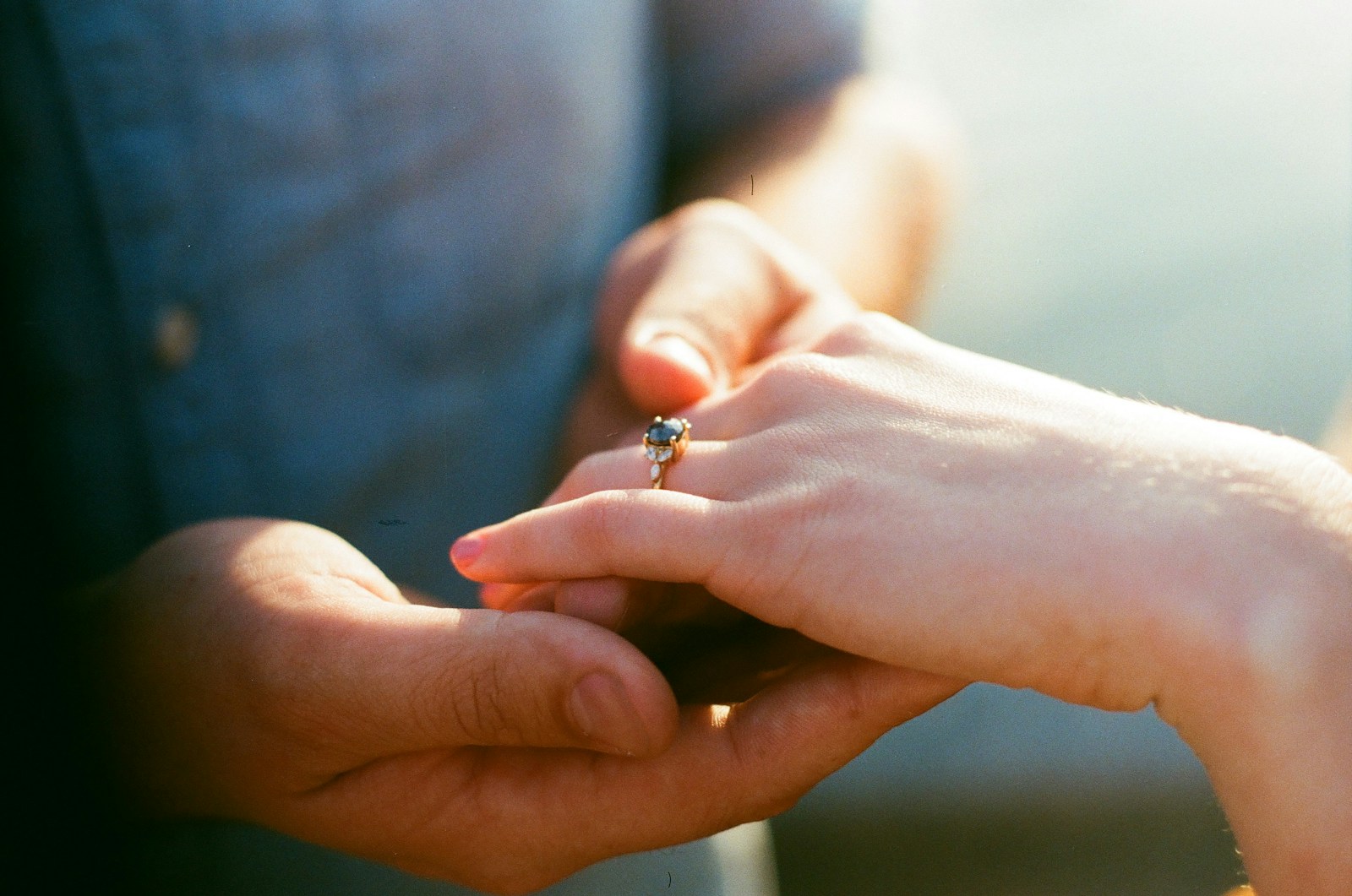 person wearing silver diamond ring
