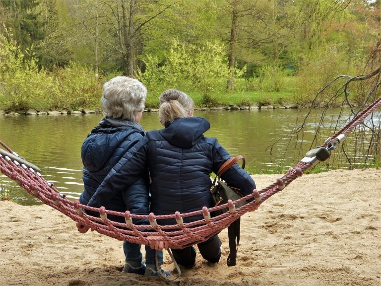 women, hammock, pond